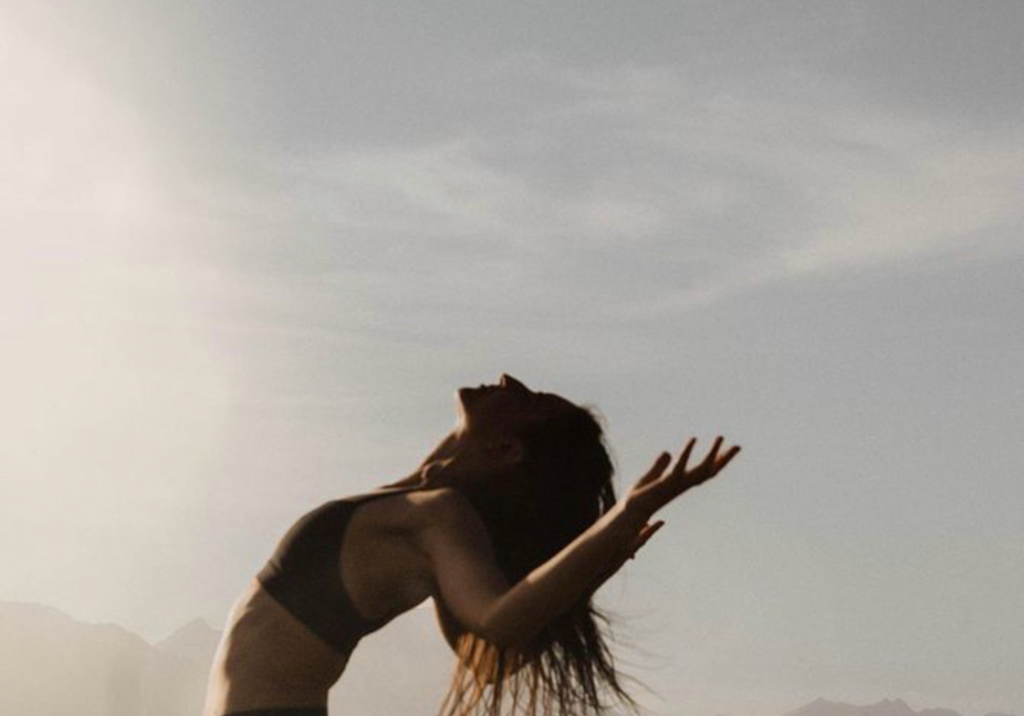 Woman in joyful backbend pose