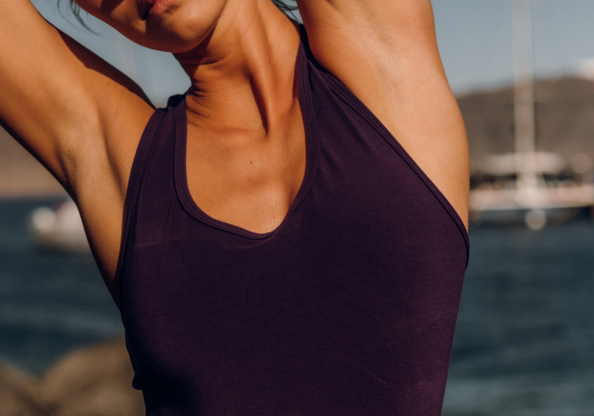 Stretching in sleeveless top